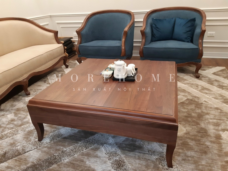 Phòng khách nhà phố, biệt thự được thi công bởi nội thất Morehome gỗ óc chó phong cách tân cổ điển mang tới cho không gian cao cấp, tiện nghi và thẩm mỹ